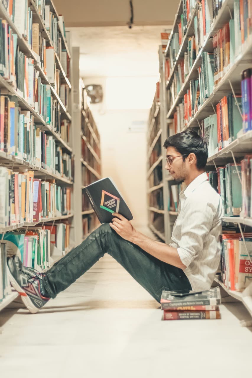 Student in library reading